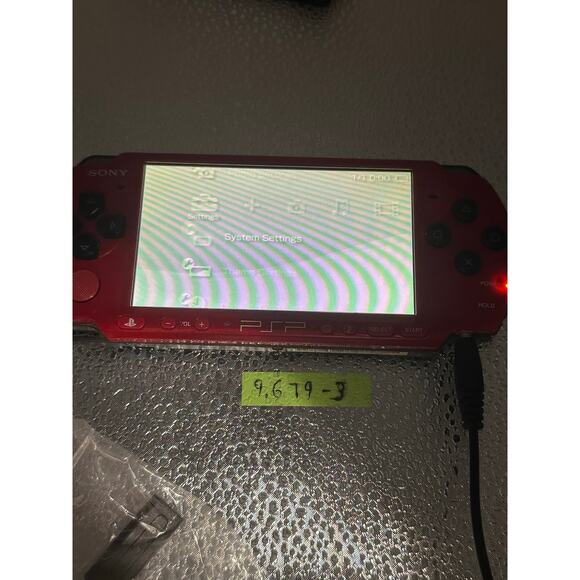 Red and black psp 3000 w/charger adapter, new battery & has glass screen lens - Picture 3 of 9